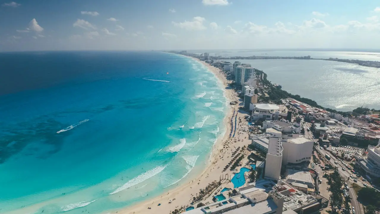 Aerial view of Cancún Hotel Zone coastline with turquoise Caribbean water and white sand beaches