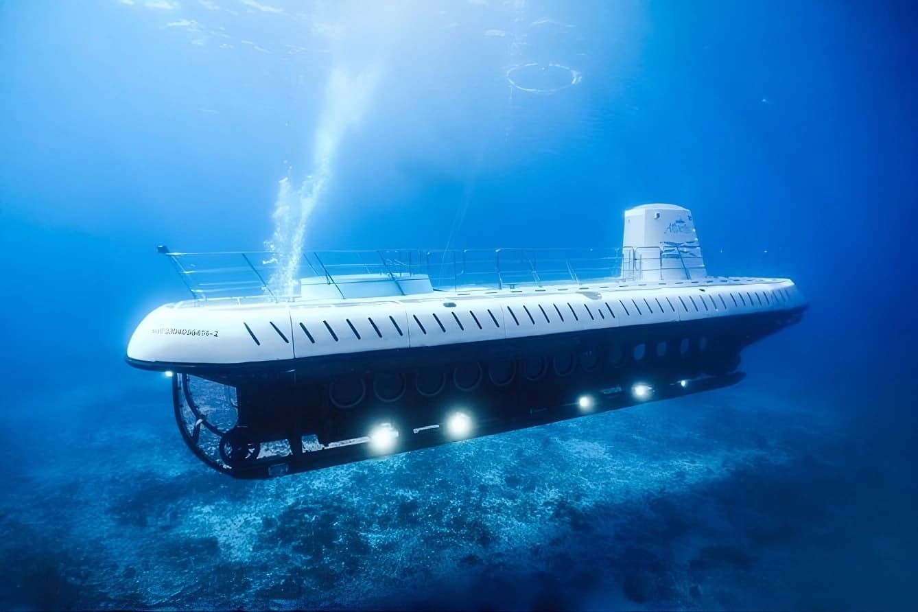 The Atlantis passenger submarine descending over a coral reef in the clear blue water off Cozumel