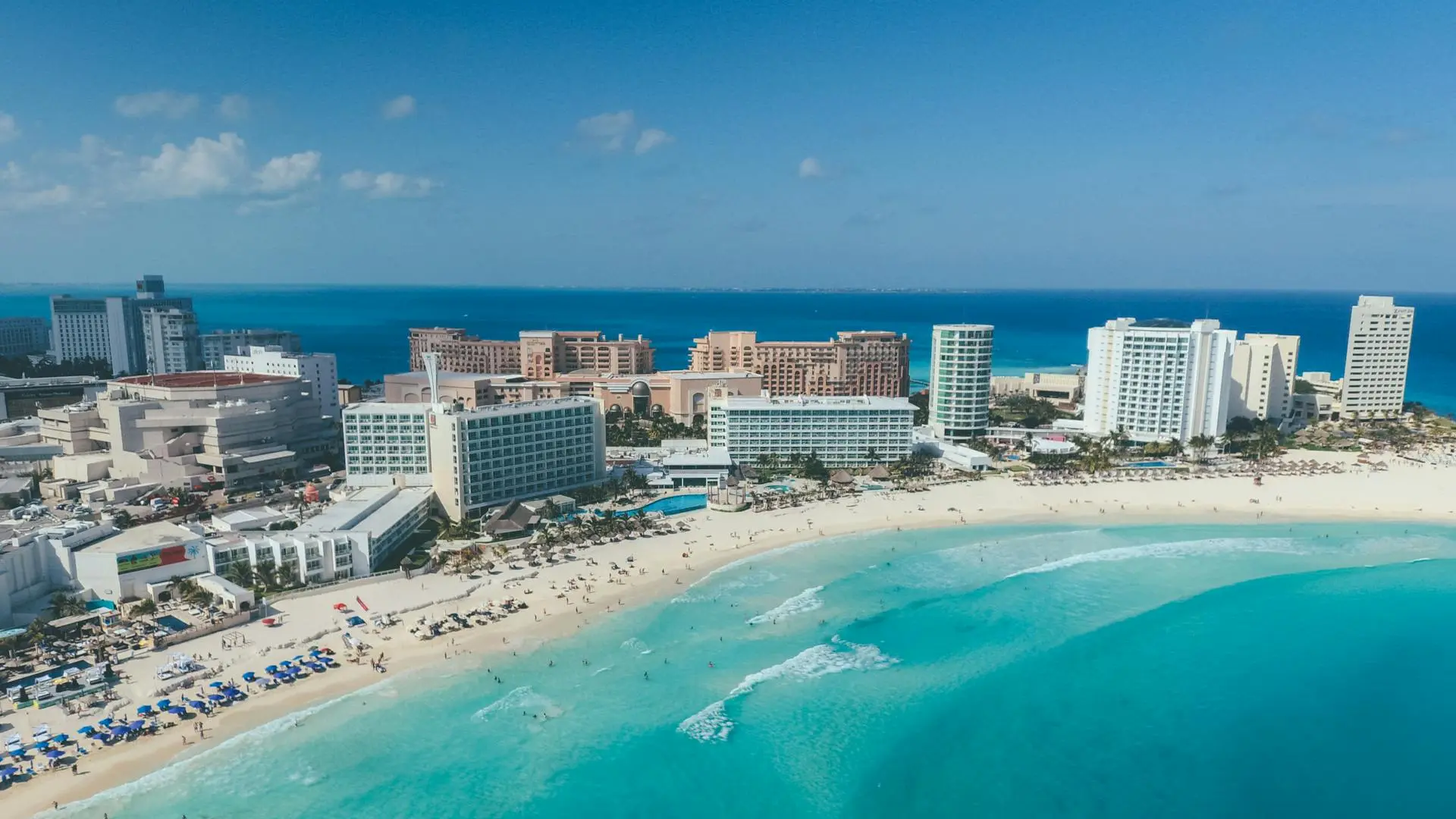 Beachfront infinity pool at a luxury all-inclusive resort on the Cancun Hotel Zone strip, Mexico