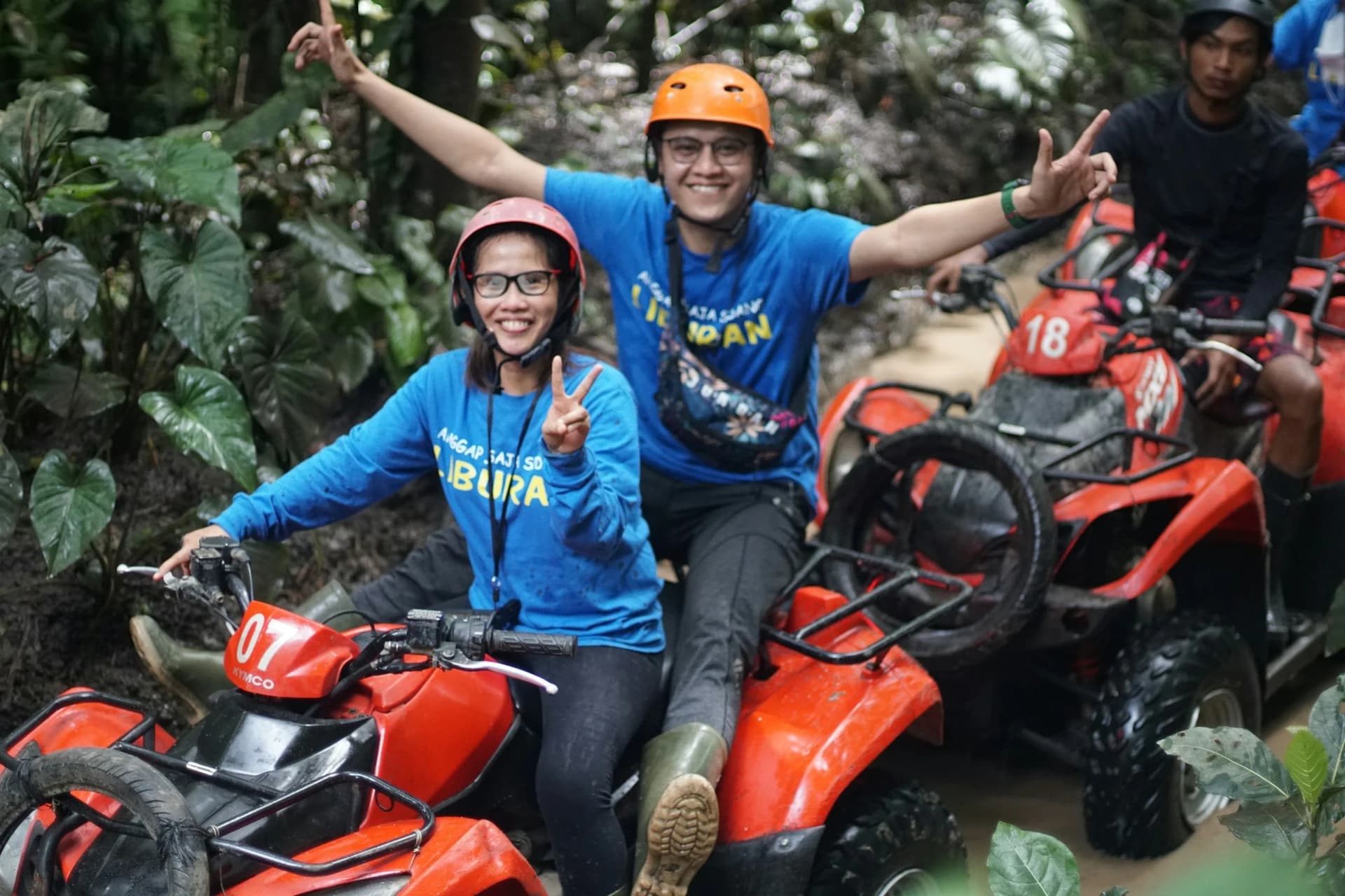 An ATV kicking up mud on a jungle trail toward the Jade Cavern cenote in Cozumel on a sunny day
