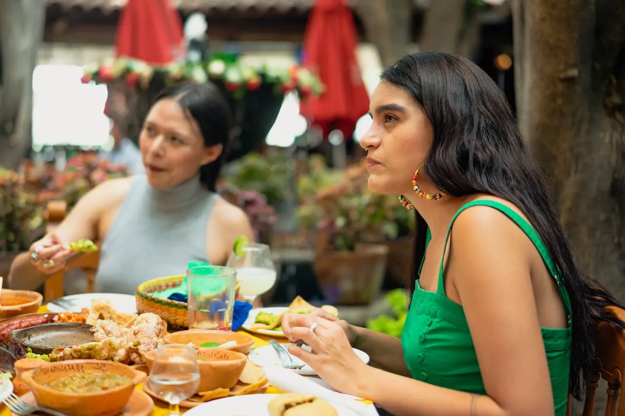 Street food vendor serving tacos at a market stall in Cancun, Mexico