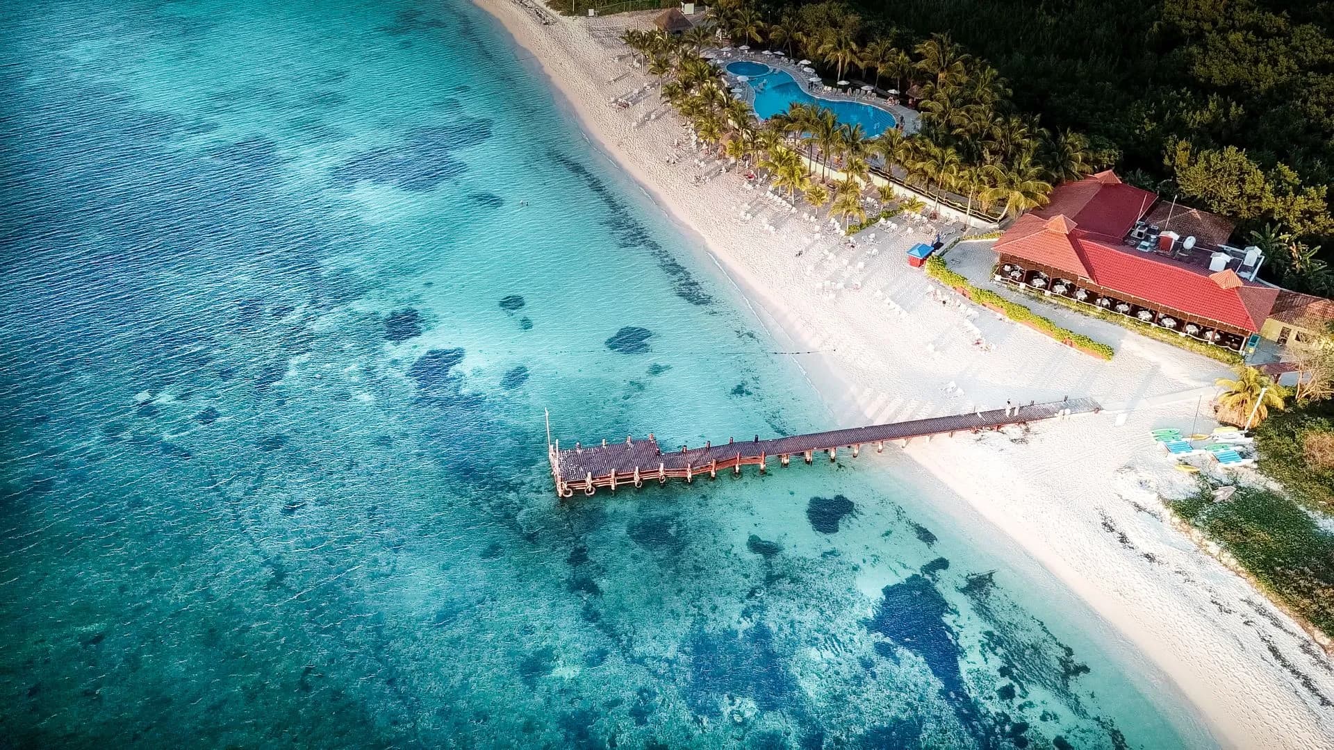 Cruise piers and calm turquoise water along the leeward coast of Cozumel on a clear day
