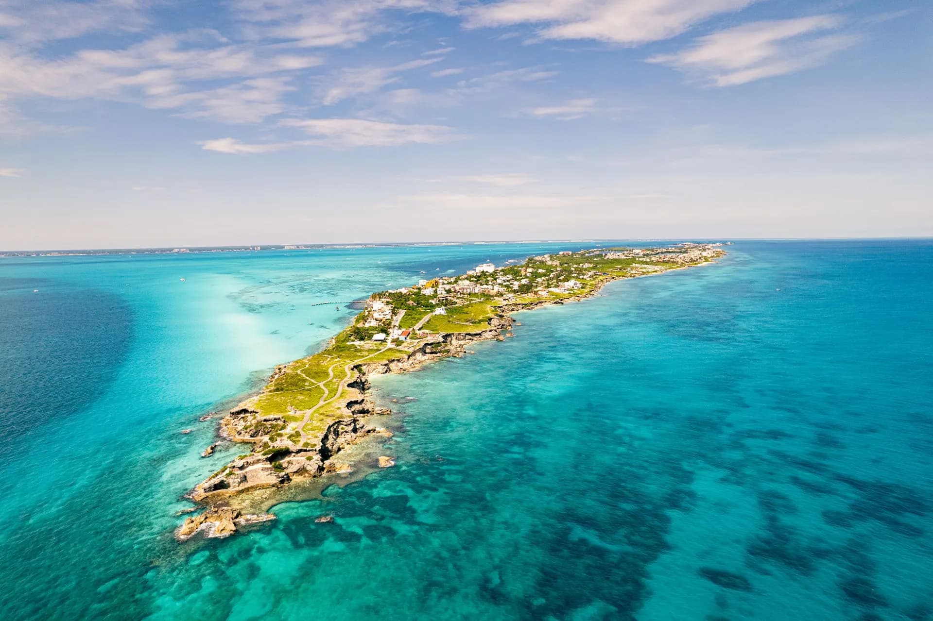 Warm turquoise Caribbean water off Isla Mujeres under a bright summer June sky during whale shark season