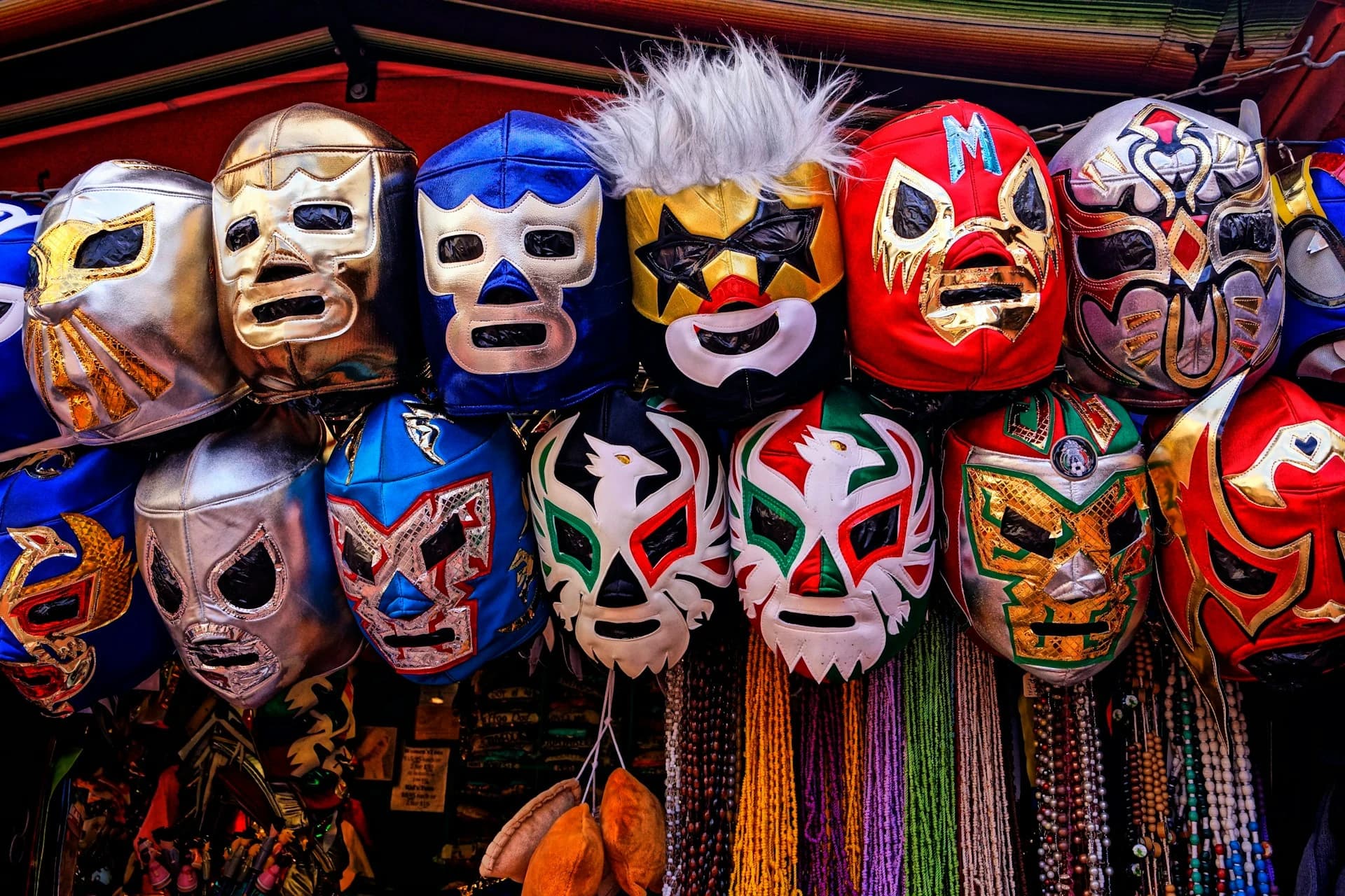 Masked luchadores wrestling in the ring at a lucha libre show in Cozumel