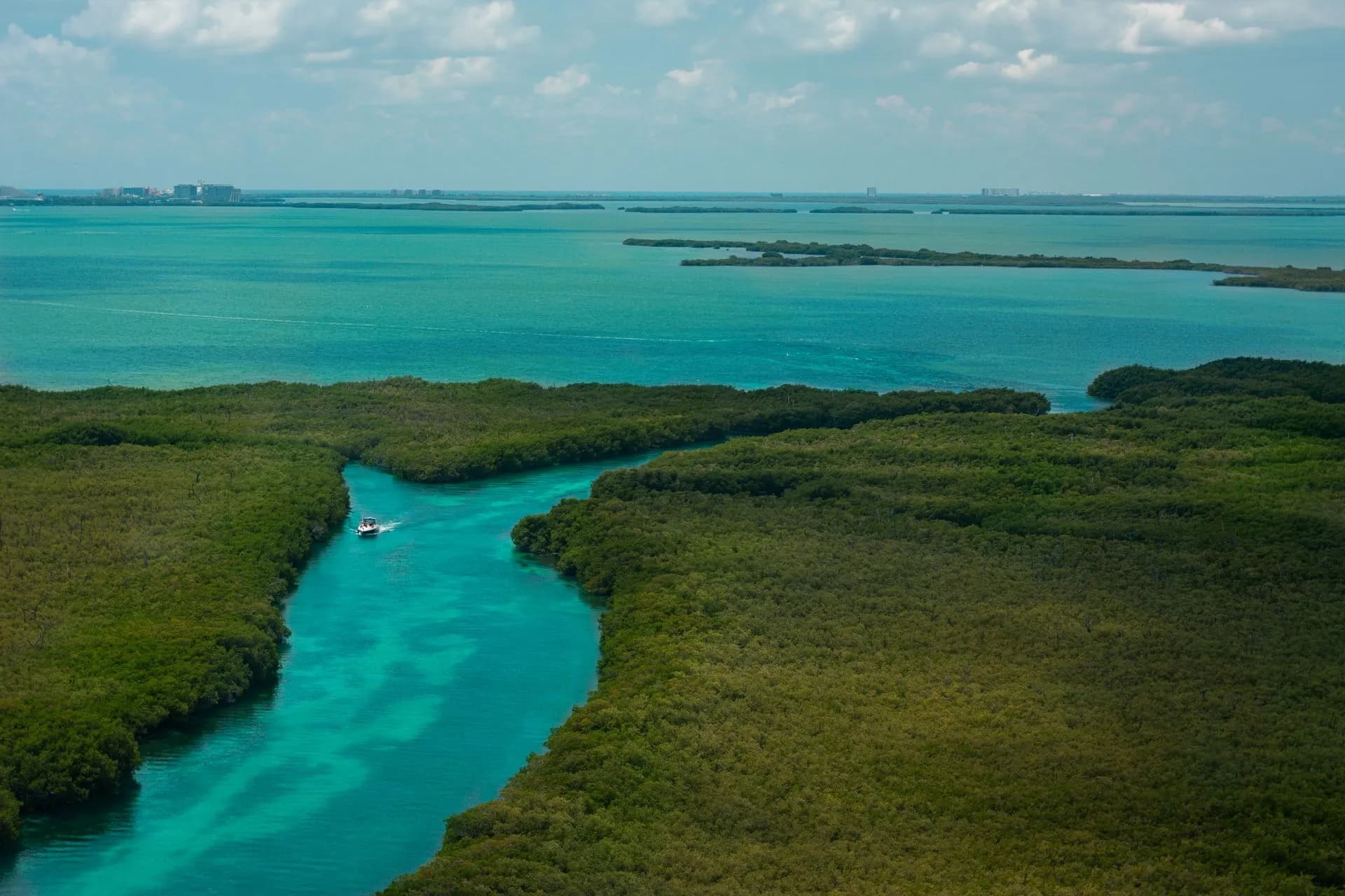 Travelers floating down a mangrove canal in the Sian Ka'an Biosphere Reserve near Tulum
