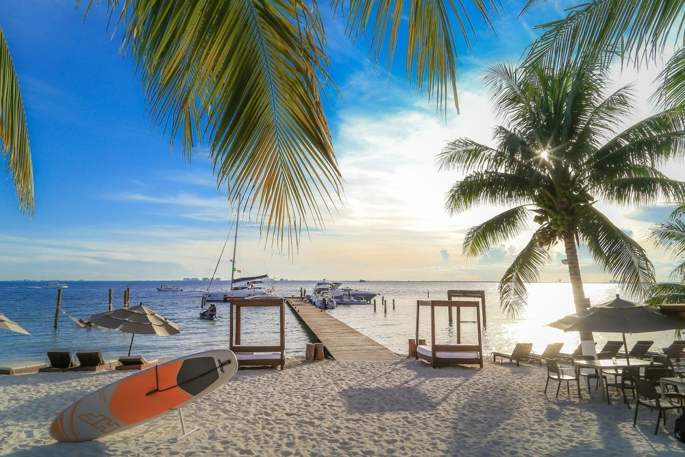 Zama Beach Club on Playa Norte in Isla Mujeres with loungers and umbrellas on the white sand beach